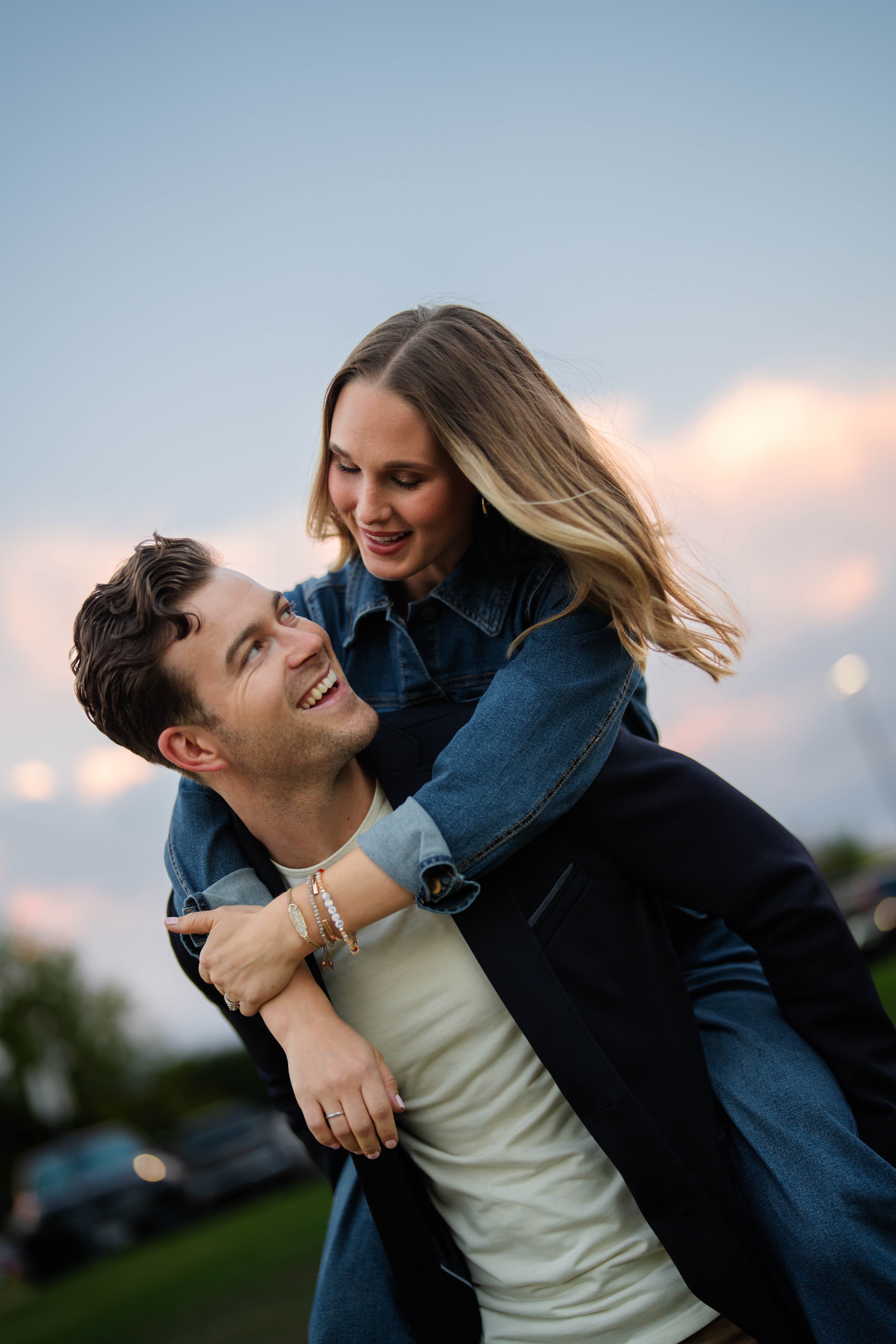 David and Mikayla Blease laughing together outdoors at sunset
